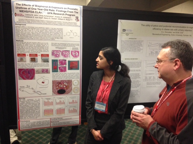 student presenting poster